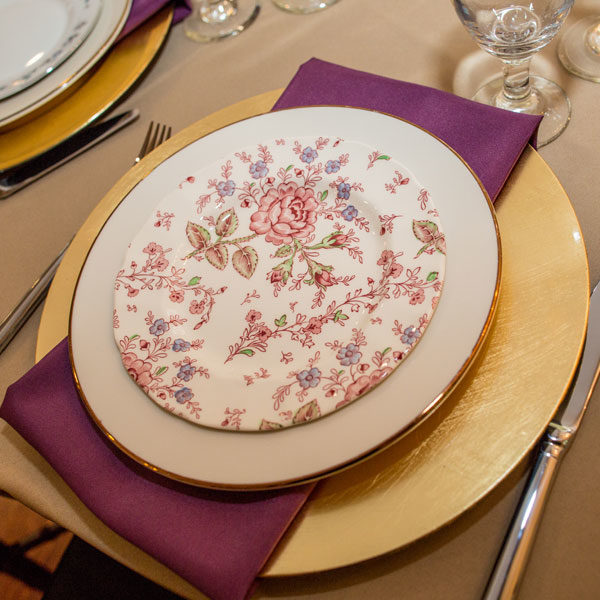 Mixed vintage china with gold charger