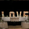 Mixed round and rectangular tables in use at an event