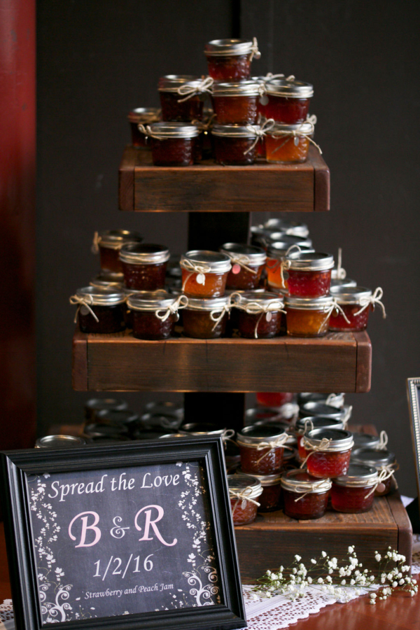 3-tier rustic cake/cupcake stand displaying wedding favors
