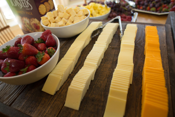 Rustic rental displays cheese and fruits